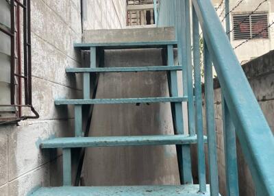 exterior stairway with blue railings