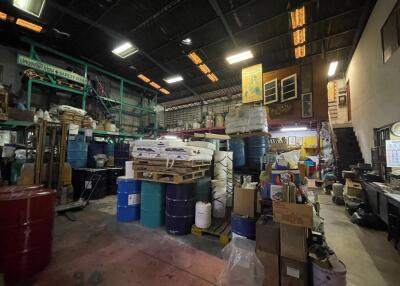 Industrial warehouse interior with various stored items