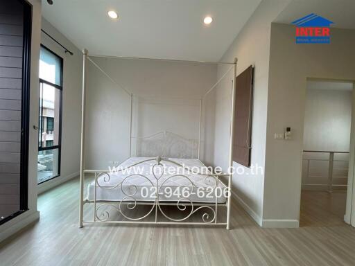 Bedroom with large window and modern decor