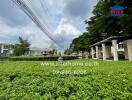 View of residential buildings with green garden