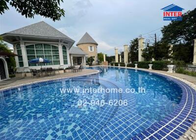 Outdoor swimming pool with nearby buildings