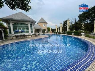 Outdoor swimming pool with nearby buildings