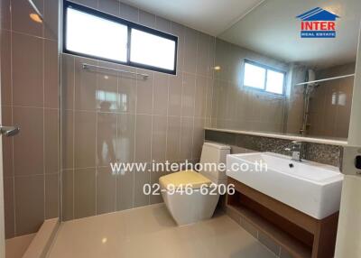 Modern bathroom with shower and vanity