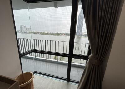 Bedroom with balcony and river view