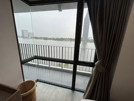 Bedroom with balcony and river view