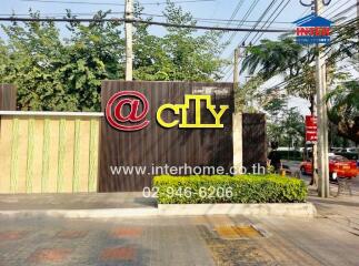 Entrance of a residential building with a sign that reads 