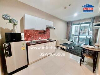 Modern kitchen area with dining space and balcony access