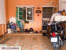 Property entrance with tiled floor and various belongings