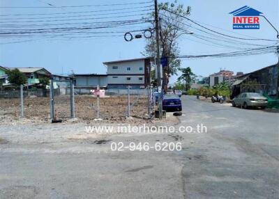 Street view with vacant land and buildings