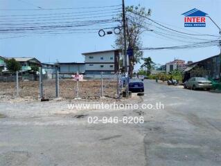 Street view with vacant land and buildings