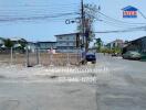 Street view with vacant land and buildings