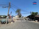 Street view with surrounding buildings and utility poles