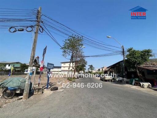 Street view with surrounding buildings and utility poles