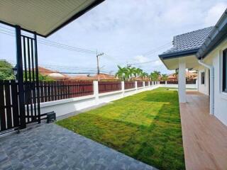 View of the backyard with lawn and patio