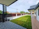 View of the backyard with lawn and patio