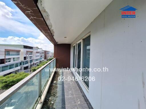 Spacious balcony overlooking the neighborhood