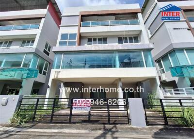 Modern residential multi-story building exterior with balconies