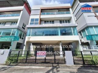 Modern residential multi-story building exterior with balconies