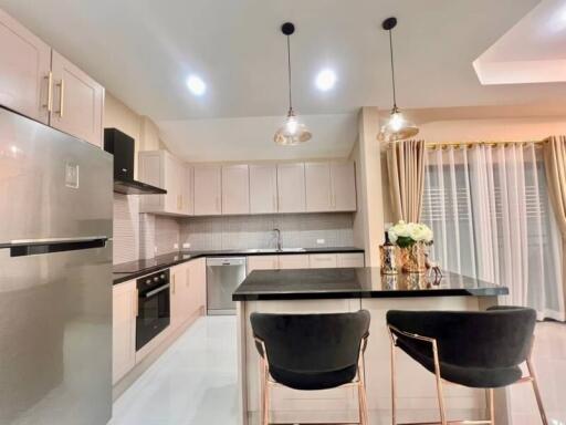 Modern kitchen with island and seating