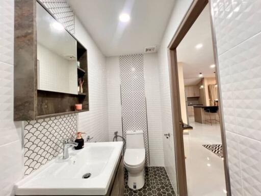 Modern bathroom with geometric tile design