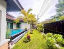 Outdoor area with pool and garden