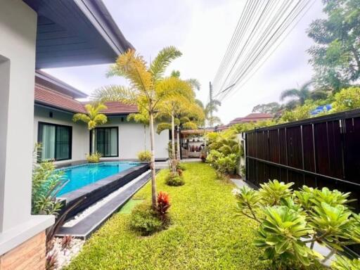 Outdoor area with pool and garden