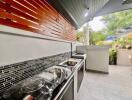 Modern outdoor kitchen area with sleek appliances