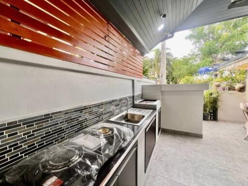 Modern outdoor kitchen area with sleek appliances