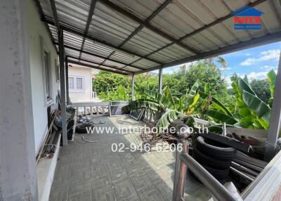 Covered balcony with greenery view