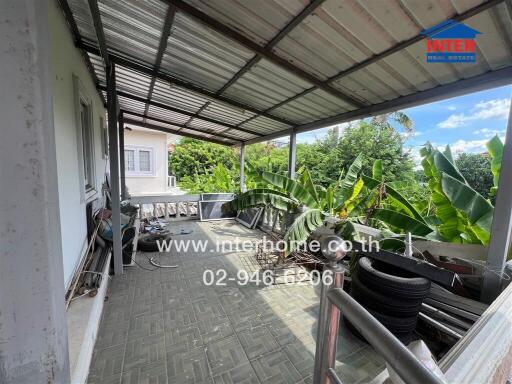 Covered balcony with greenery view