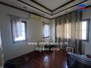 Bedroom with wooden floor and windows