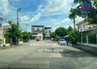 Street view of residential and commercial buildings