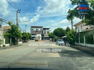 Street view of residential and commercial buildings