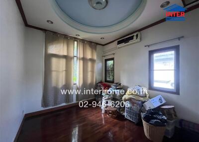 Bedroom with wooden floor and ceiling fan