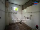 Bathroom with white tiles and ventilation featuring a shower area