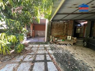 Outdoor area with garage and garden