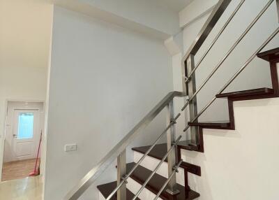 Staircase with metal railings in an interior setting