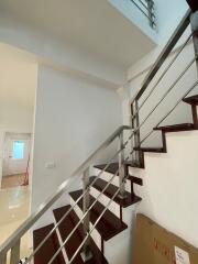 Staircase with metal railings in an interior setting