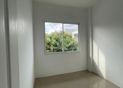 Empty bedroom with large window