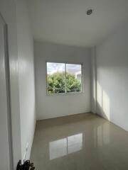 Empty bedroom with large window