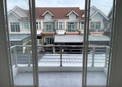 View of a balcony overlooking neighboring houses