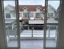 View of a balcony overlooking neighboring houses