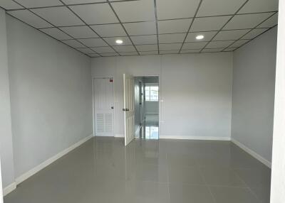 Empty room with tiled floor and recessed lighting