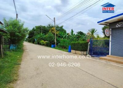 Street view with greenery and real estate office