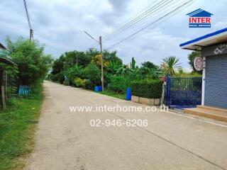 Street view with greenery and real estate office