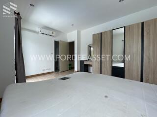 Spacious bedroom with modern design and ample storage