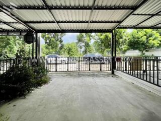 Covered garage space with gate