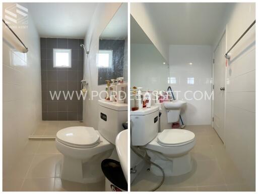 Bathroom with toilet, shower, and sink