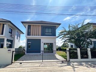 Modern two-story house with front yard and driveway