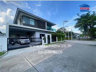 Modern two-story house with carport